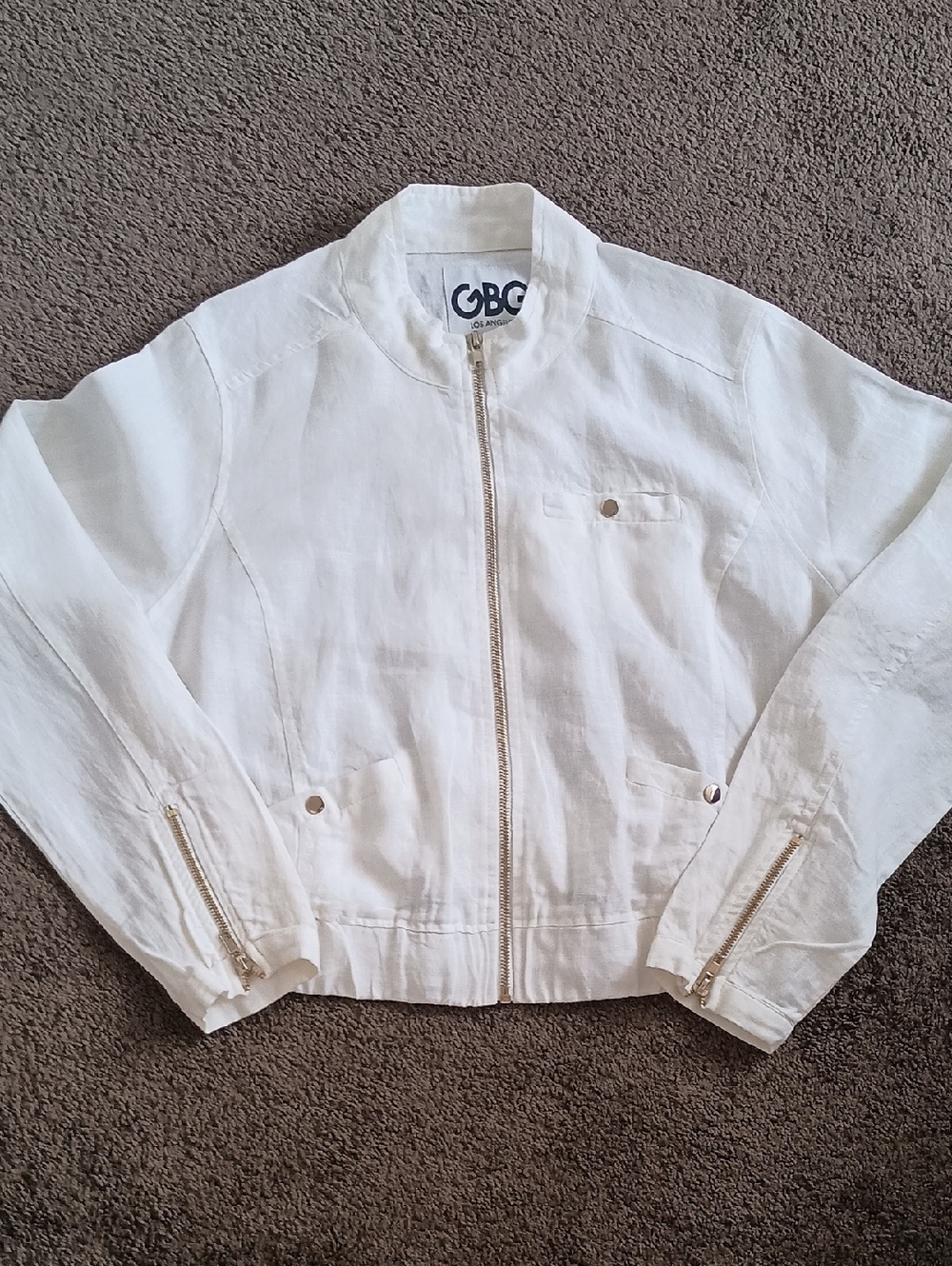 GBG Los Angeles bomber-style jacket with gold-toned zippers and hardware.Size L